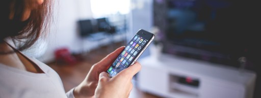 Woman Wearing White V Neck Shirt Using Space Gray Iphone 6