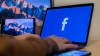 Person accessing Facebook on a Laptop.